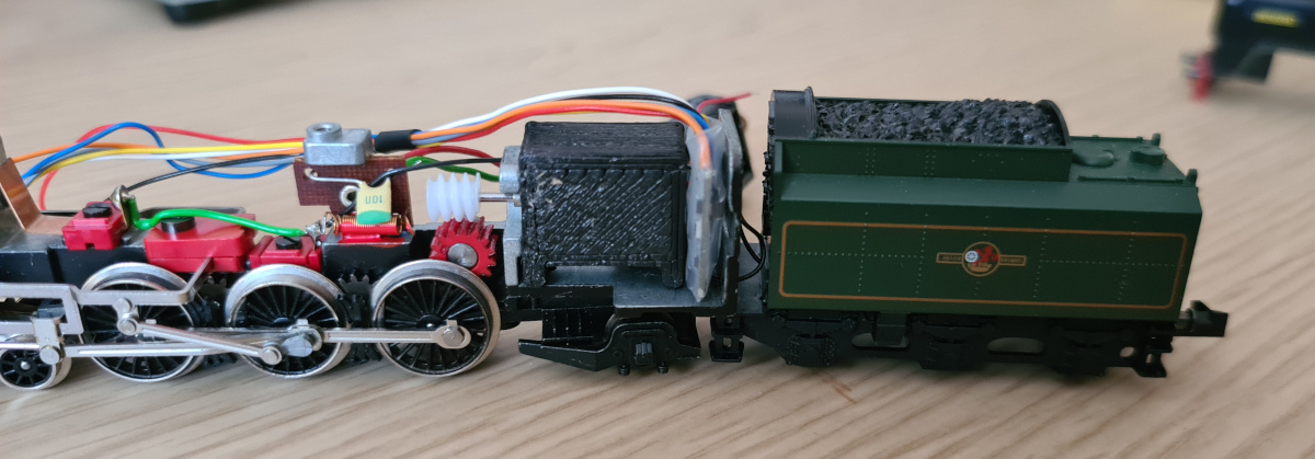 The decoder can fit behind the motor, with the wires doing a 90° turn as they come out of the decoder, though the fit is too tight for comfort unless the sleeve is removed.